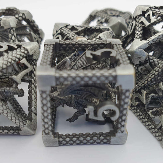 Encapsulated silver dragon metal dice set